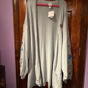 Her Universe Studio Ghibli ‘s Ponyo light blue cardigan.